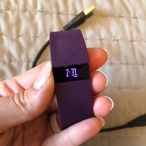 Purple women’s Fitbit HR activity tracker